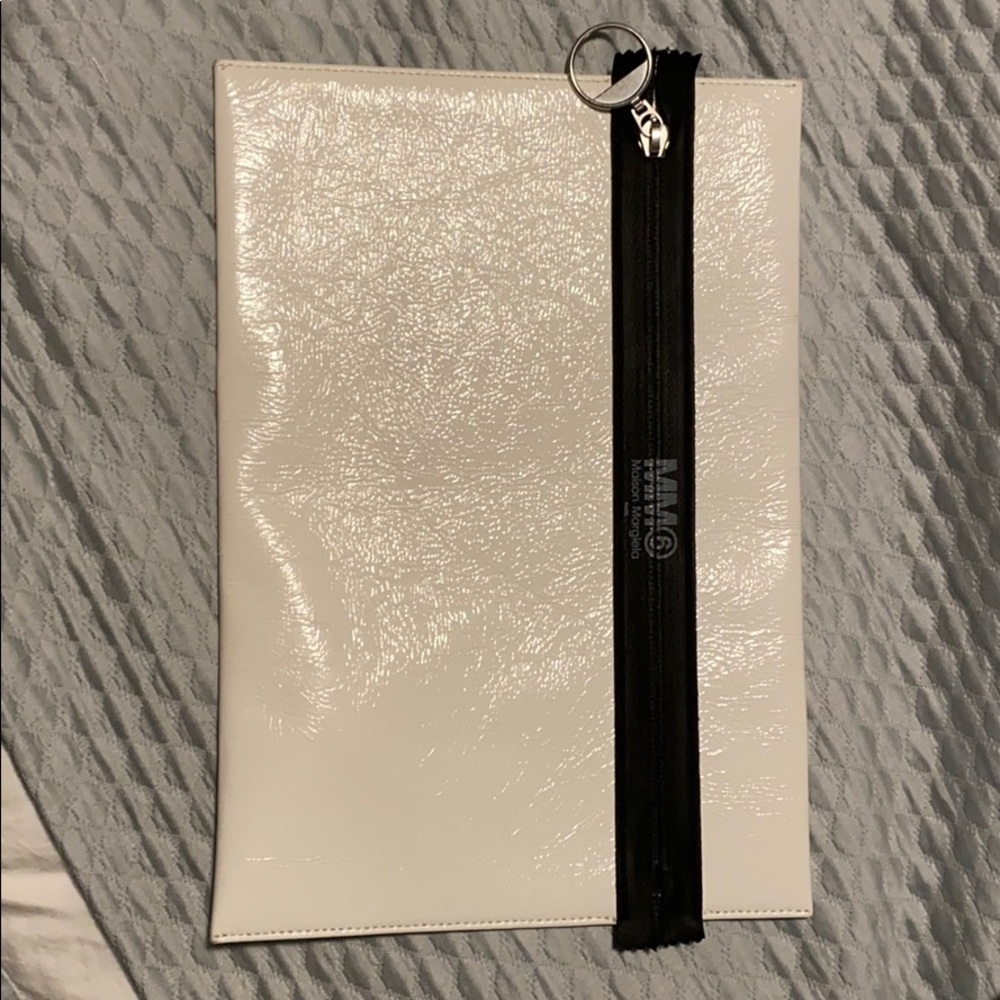 White with black zipper leather clutch